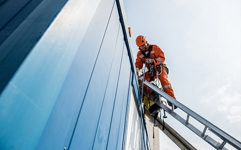 A worker performing tasks at height.